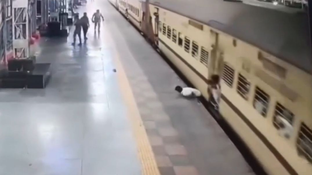 Man Leaps Onto Moving Train, Falls and Gets Dragged Spinning For Meters